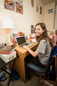 Student using devices in dorm room