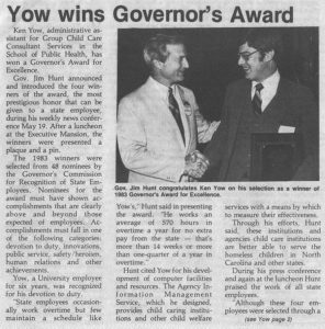 Newspaper clipping of Yow shaking hand of Gov. Jim Hunt and text of winning Governor's Award