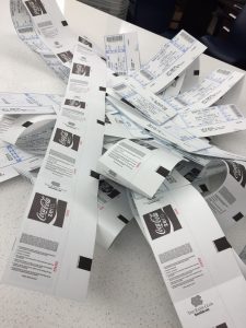 pile of printed athletics tickets