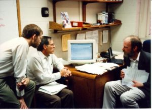 In October 1996, Ben Aycock (OIS), Steve Squires and Tim Cline (HSL) discuss the new UNCLE web interface