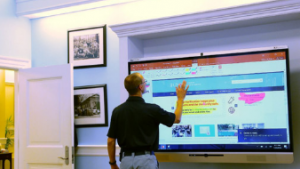 Mark Wampole at large touchscreen digital display
