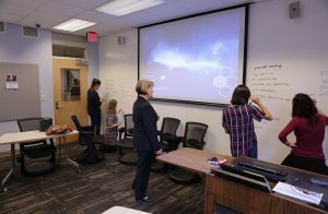 Glynis Cowell, Teaching Professor in Romance Studies, works with students using whiteboard walls in flexible classroom Dey 205.