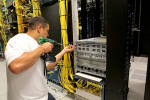 Mike Whitfield installs equipment in the ITS Franklin data center