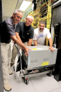 Charles Woody, Mike Harris and Mike Whitfield install equipment at the ITS Franklin data center