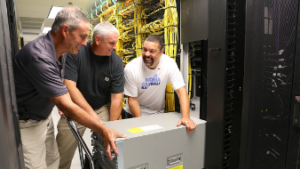 Charles Woody, Mike Harris and Mike Whitfield install equipment at the ITS Franklin data center