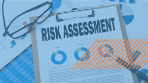 A clipboard holds a report with the bold title Risk Assessment. In the background are charts and other analyses