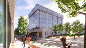 An artist's rendering of the new innovation hub, viewed from across Rosemary Street. The building is roughly rectangular, with a stone or brick ground floor, then five stories of glass above it.