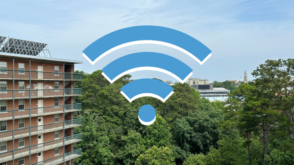 A Carolina Blue Wi-Fi symbol floats over a view of Kenan Stadium and the distant Bell Tower