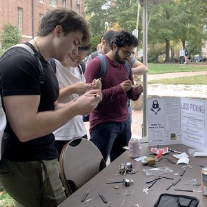 A group of students try their hand at lock picking