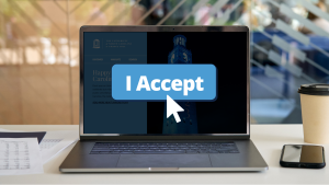 A laptop displays the UNC homepage. An oversized "I accept" cookie banner button and mouse cursor are overlaid