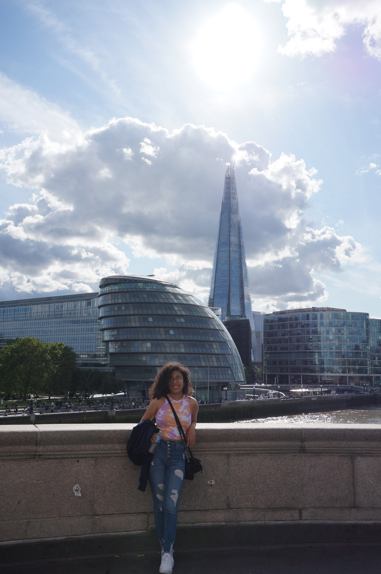 Lesley Gonzalez posing in front of a London skyscraper known as "the Shard."