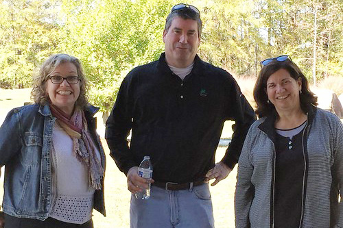 Anita Collins, Don Hepp and Maribel Carrion stand together outdoors